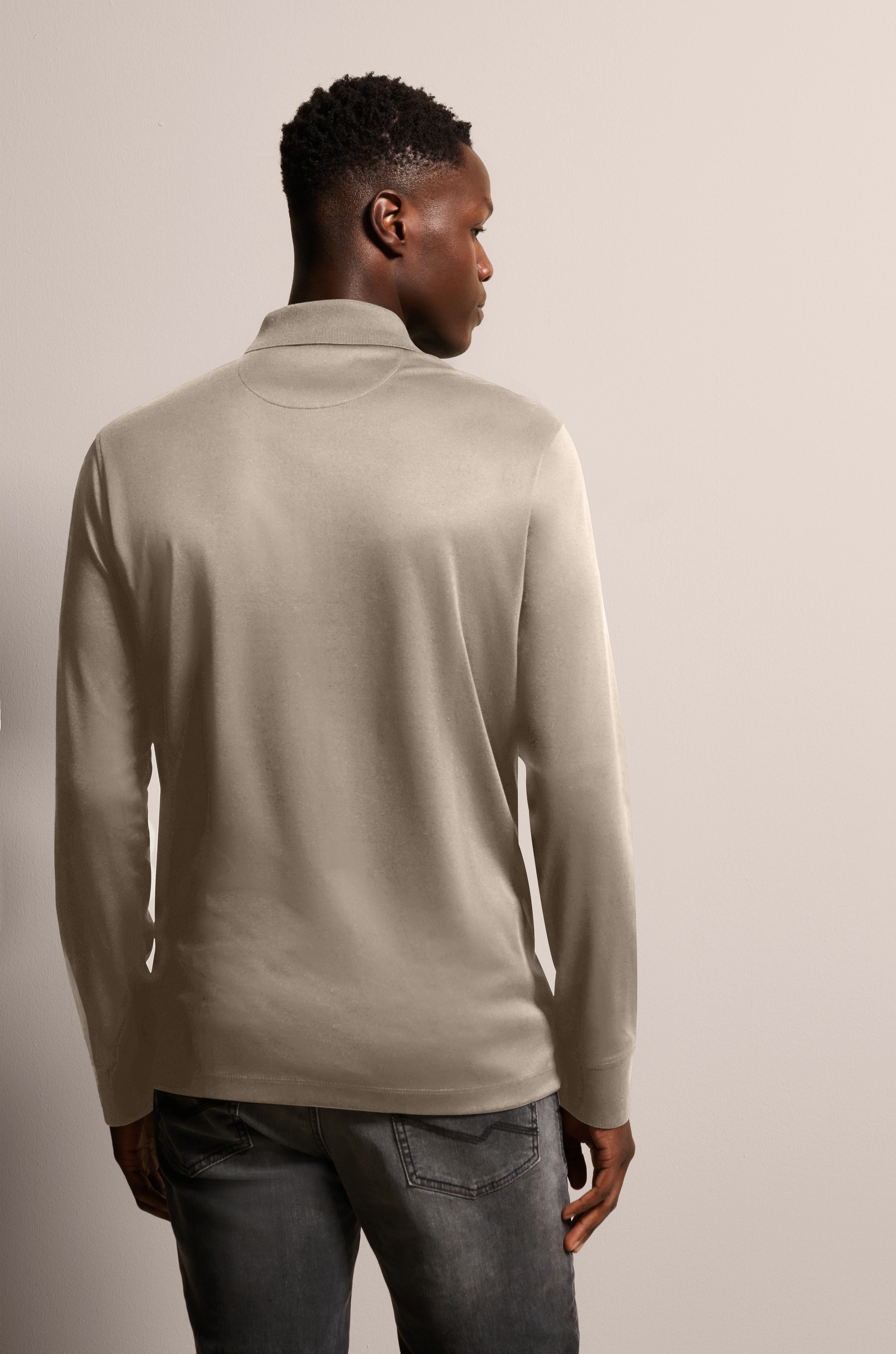 Beige bugatti long-sleeve shirt and jeans from behind, casual model image.