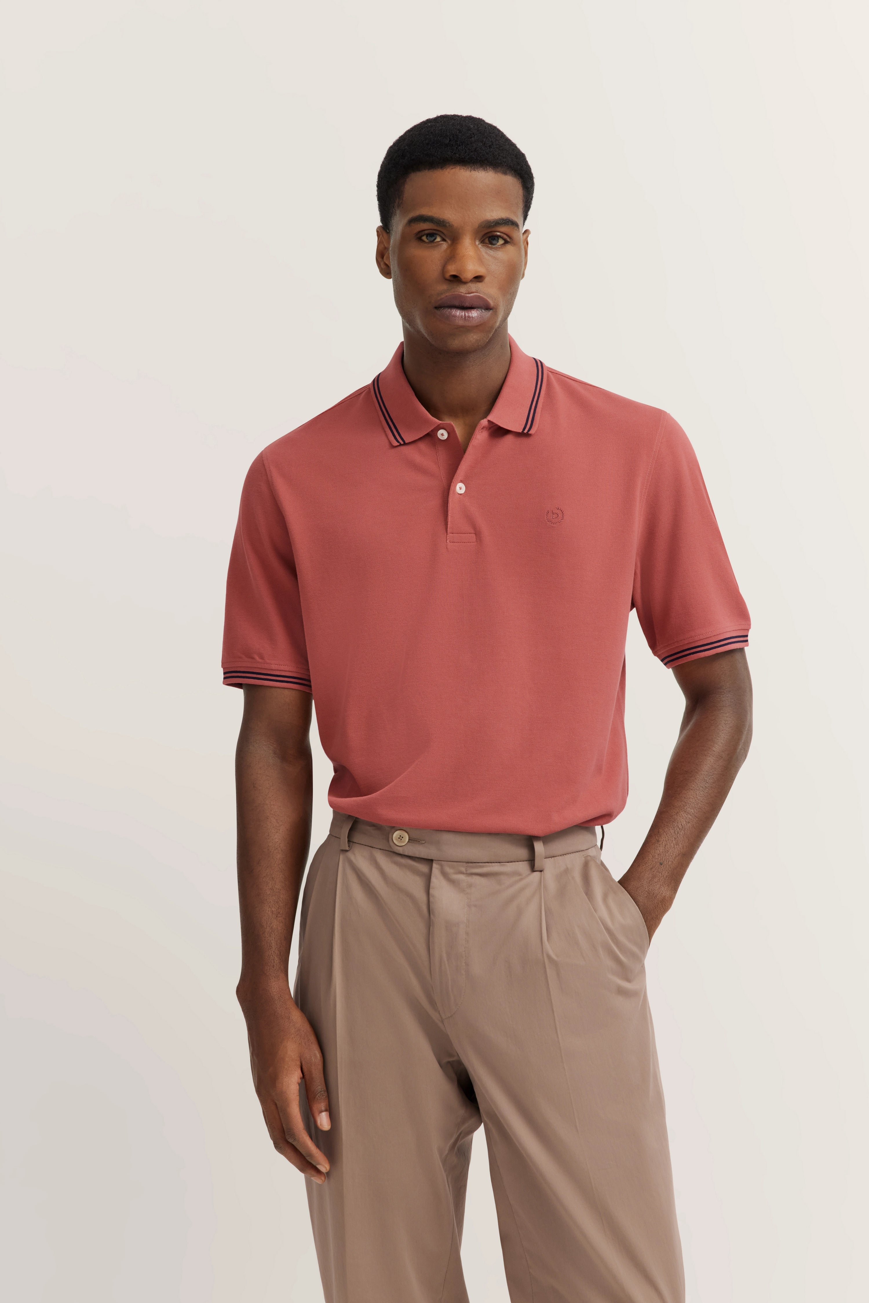bugatti red polo shirt with collar, paired with beige pants, exuding refined Italian-inspired elegance.