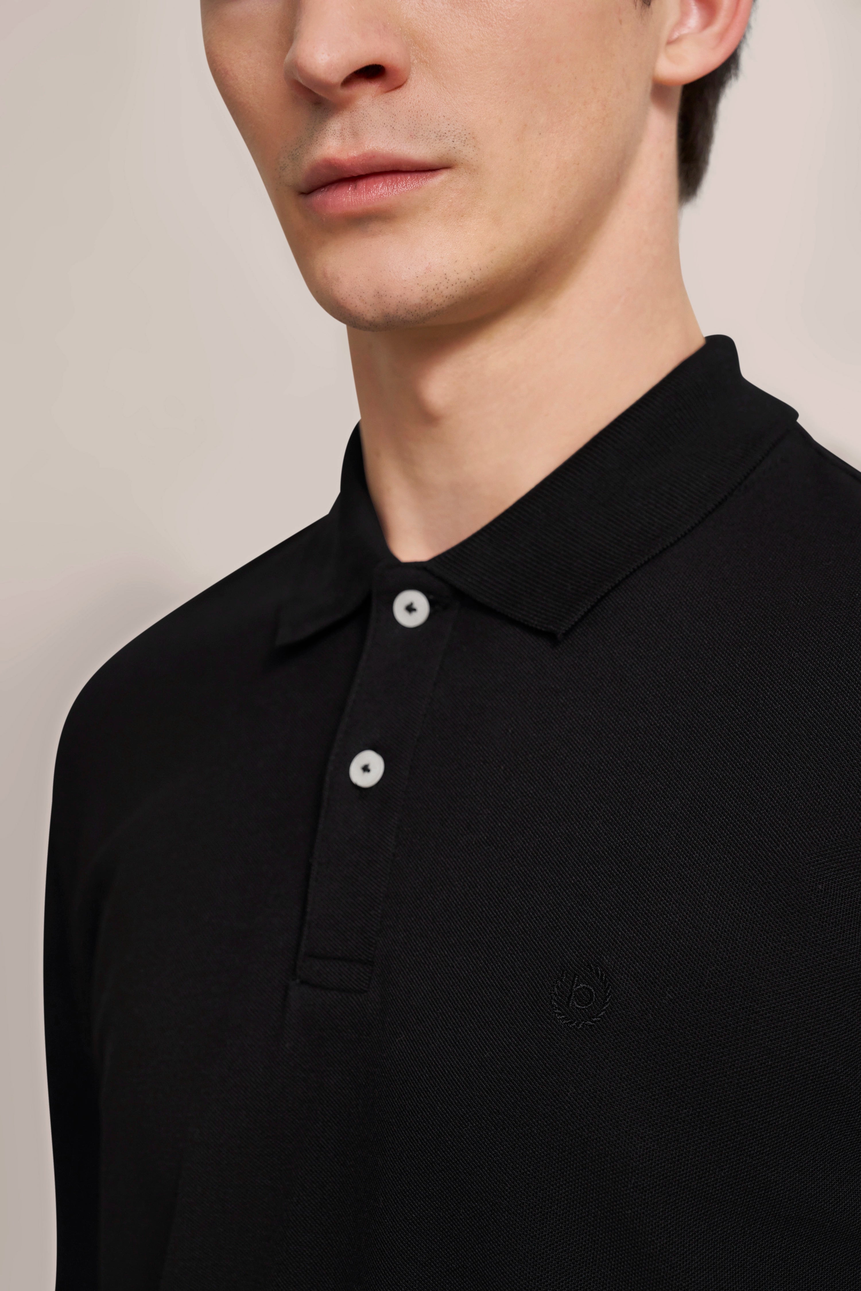 Black bugatti polo shirt, bust image, elegant design with white buttons.