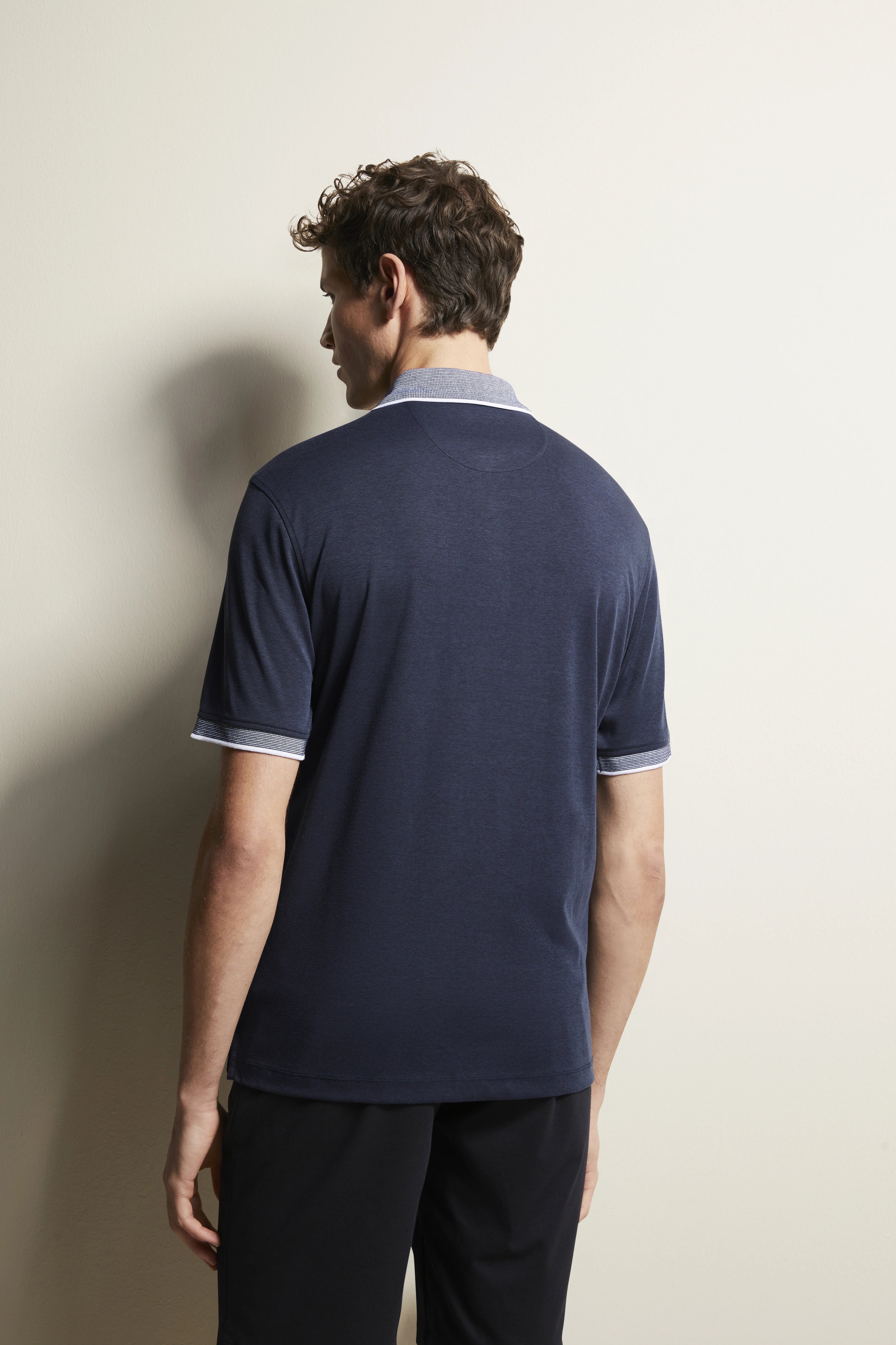 bugatti navy polo shirt, back view on model, casual outfit with short sleeves.