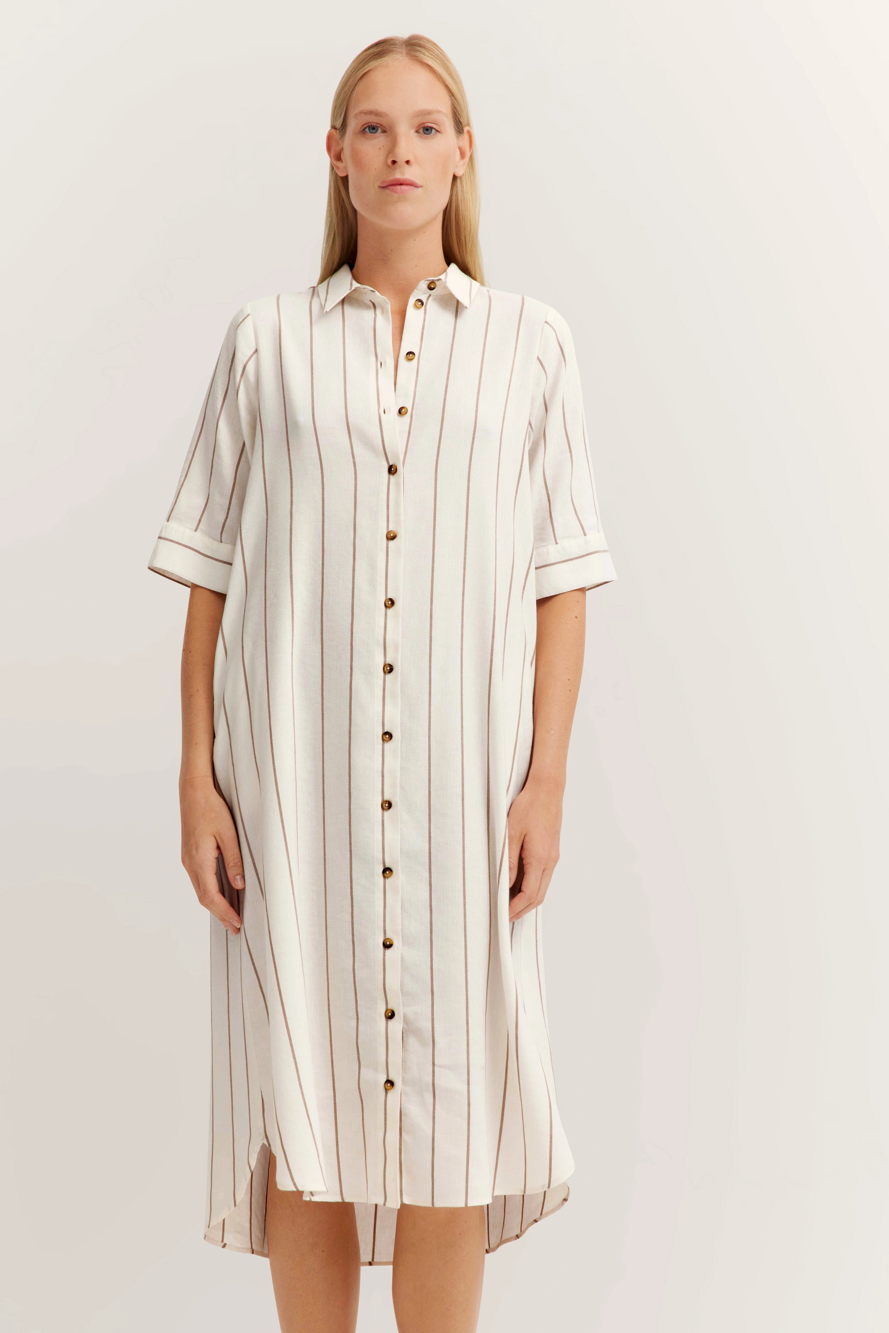 White shirtdress with brown stripes, bust view.